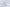 White gaming mouse on a light gray background